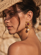 woman wearing vintage gold pearl drop earrings