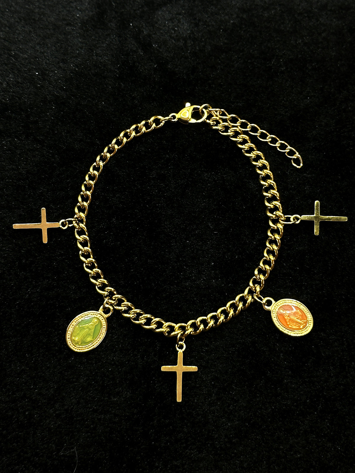 Virgin Mary pendant on a gold chain bracelet