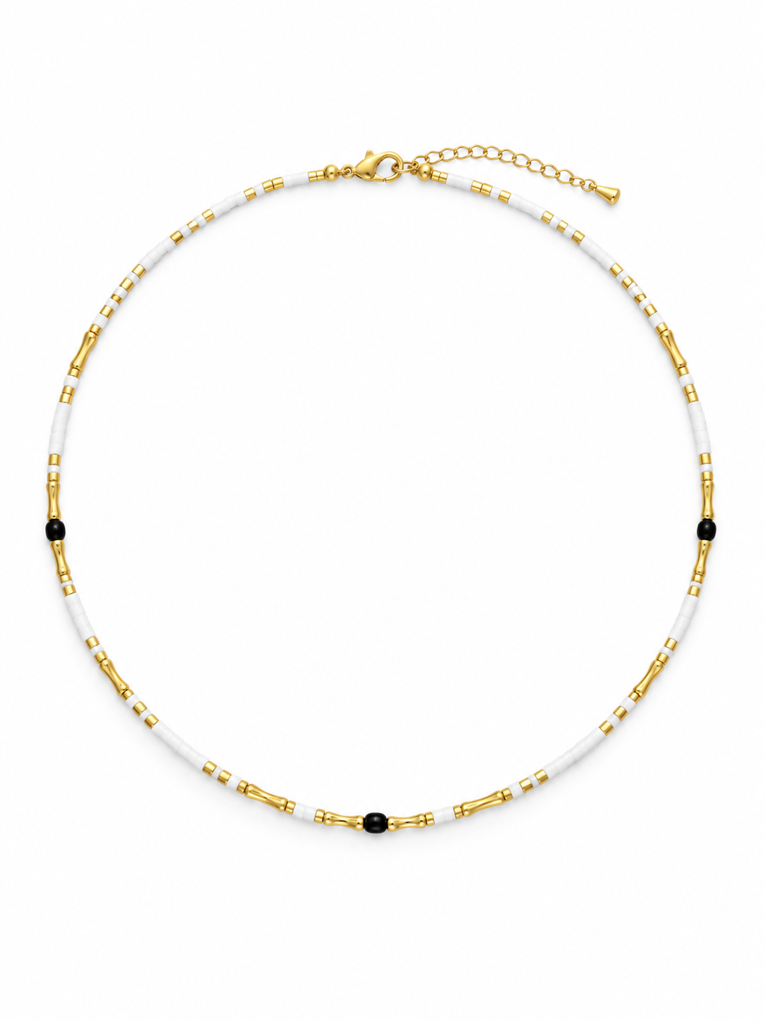Close-up of white beads arranged along a delicate necklace