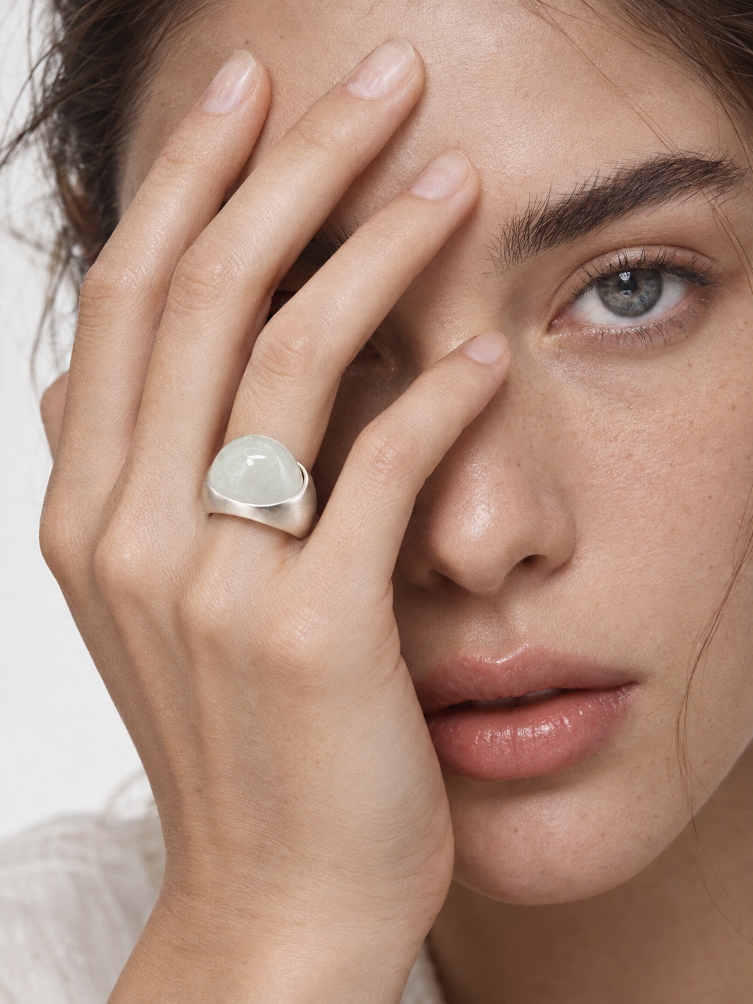 White crystal statement ring worn on finger