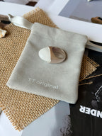 Side view of wide white crystal statement ring