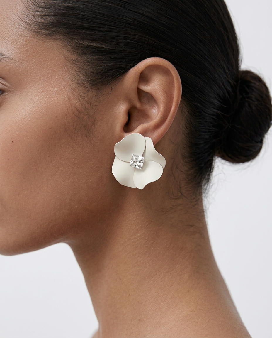 woman wearing white 3D flower earrings