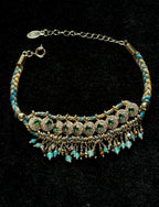Yellow and blue braided rope bracelet with natural stone tassel details