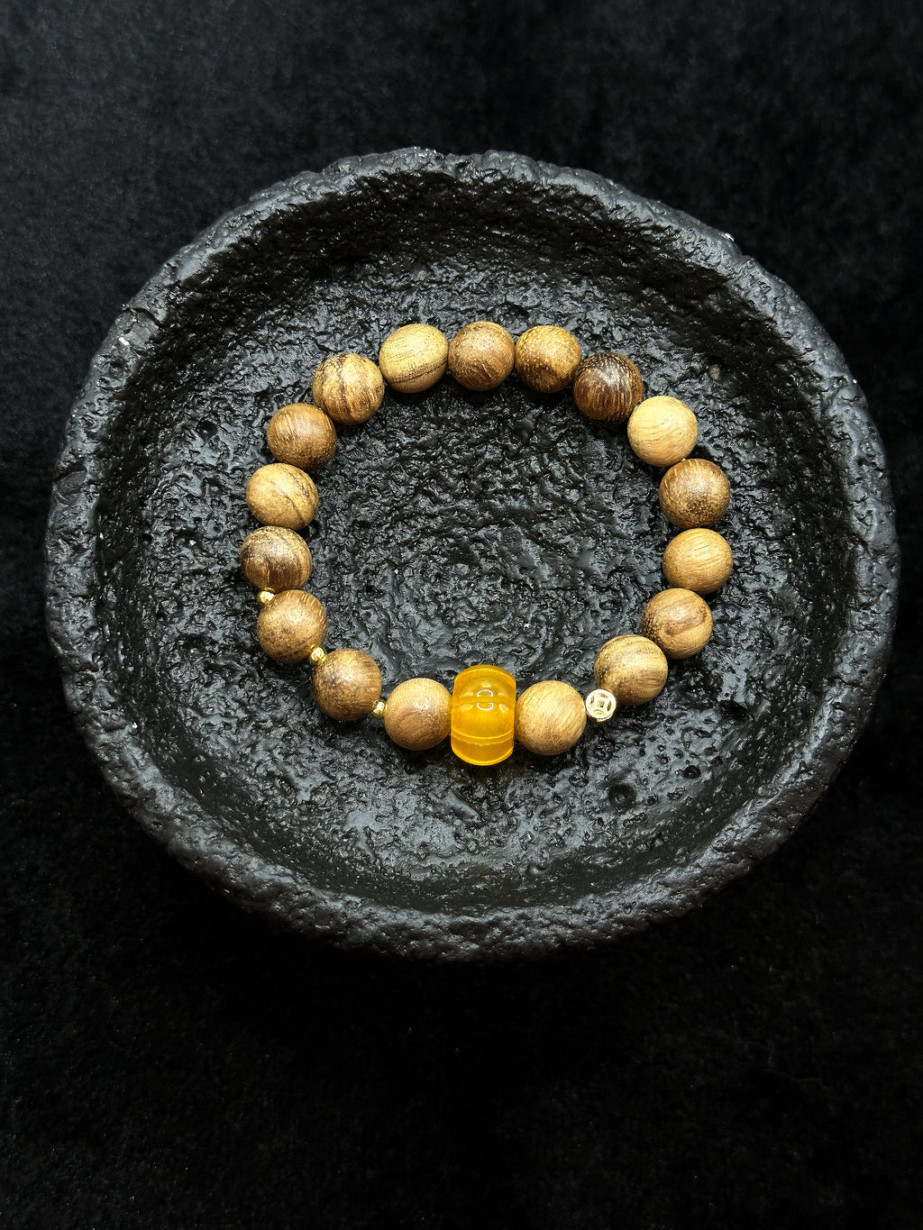 Full view of yellow chalcedony and agarwood bracelet